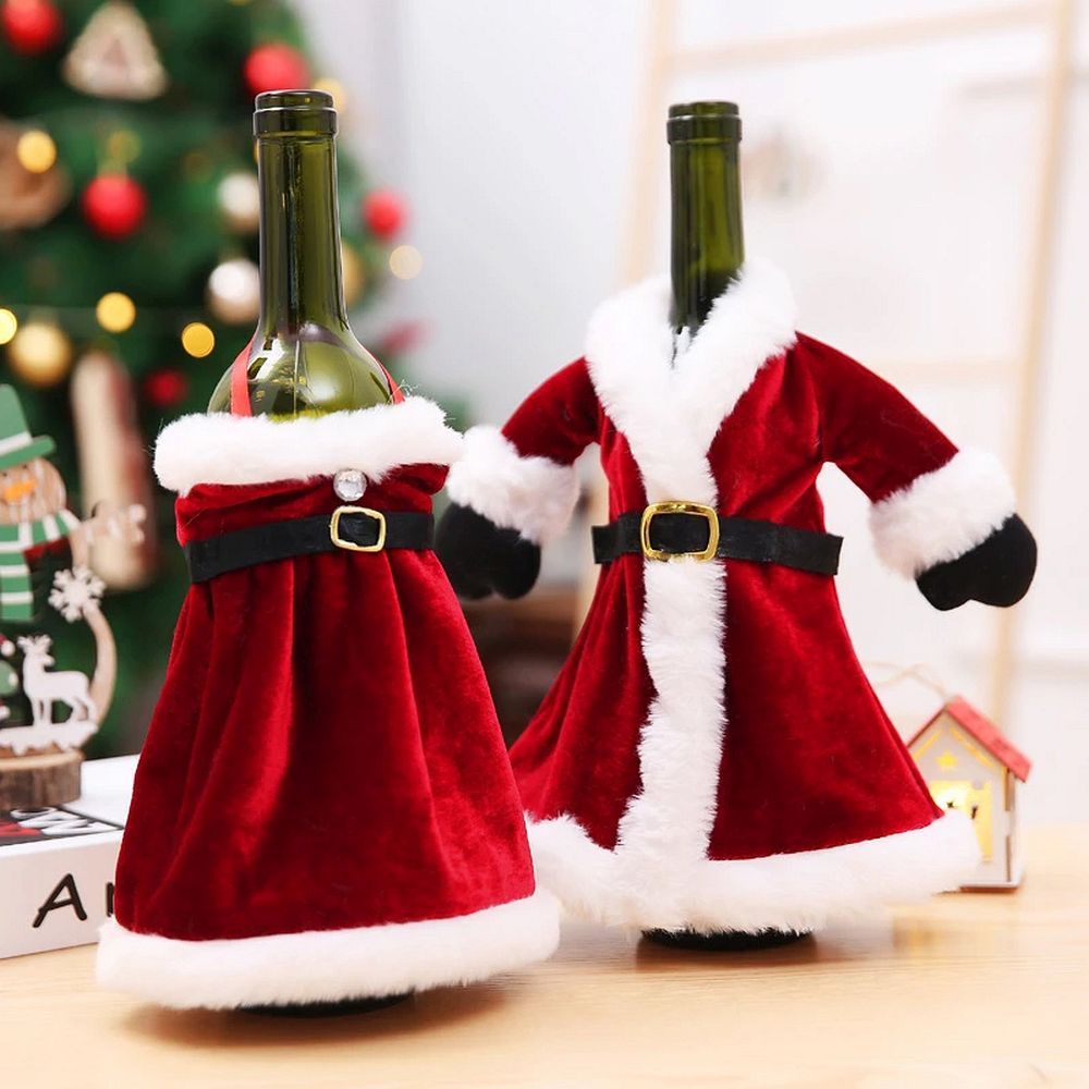 cf9783496ee8e5283bddbcb5cb3e6b5b Christmas Bottle Cover "Christmas Dress" Pattern RC-K-301 Multicolor Bottle Decoration for the Holidays This charming bottle cover in the shape of a Christmas dress is a delightful way to decorate bottles during the Christmas season. Perfect for gifts, Christmas table decorations, or as a fun addition to bottles of drinks during holiday parties. Colorful, Festive Design The cover features a cheerful mix of red, green, and white, creating a joyful holiday atmosphere. It looks like a mini dress, giving the bottle a unique and decorative touch. Versatile Use Ideal for wine, champagne, juice, or any other bottles. A perfect way to transform an ordinary bottle into a festive holiday decoration. Great Gift Idea This bottle cover also makes a great gift idea – a decorated bottle becomes an original and special present for loved ones. ✅ Specifications: Model: RC-K-301 Pattern: Christmas dress Color: Multicolor (red, green, white) Use: Bottle decoration, gift, Christmas table ornament Material: Fabric ✨ Add a touch of holiday magic – beautiful bottle cover for your celebrations!