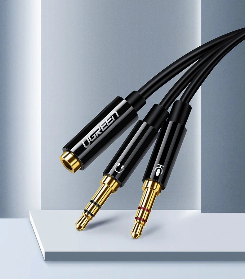[RETURNED ITEM] Ugreen AUX splitter cable 3.5 mm mini jack (female) - 2x 3.5 mm mini jack (male - microphone and headphones) black (AV140 20899)eng