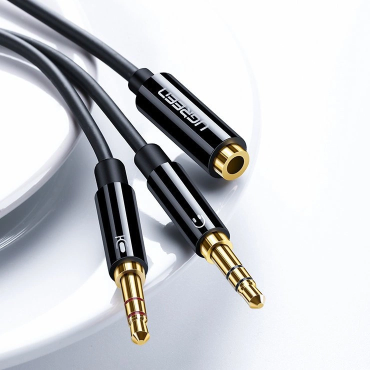 [RETURNED ITEM] Ugreen AUX splitter cable 3.5 mm mini jack (female) - 2x 3.5 mm mini jack (male - microphone and headphones) black (AV140 20899)eng