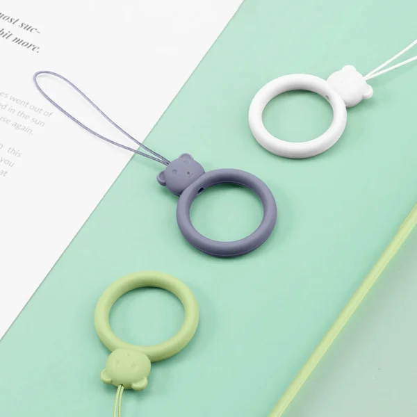 A silicone lanyard for a phone bear ring on a finger orangeeng